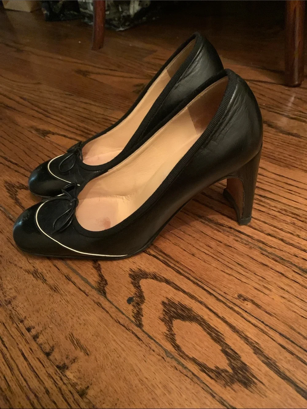 CHANEL Black Leather Ballet Flats with Bow and Gold Trim